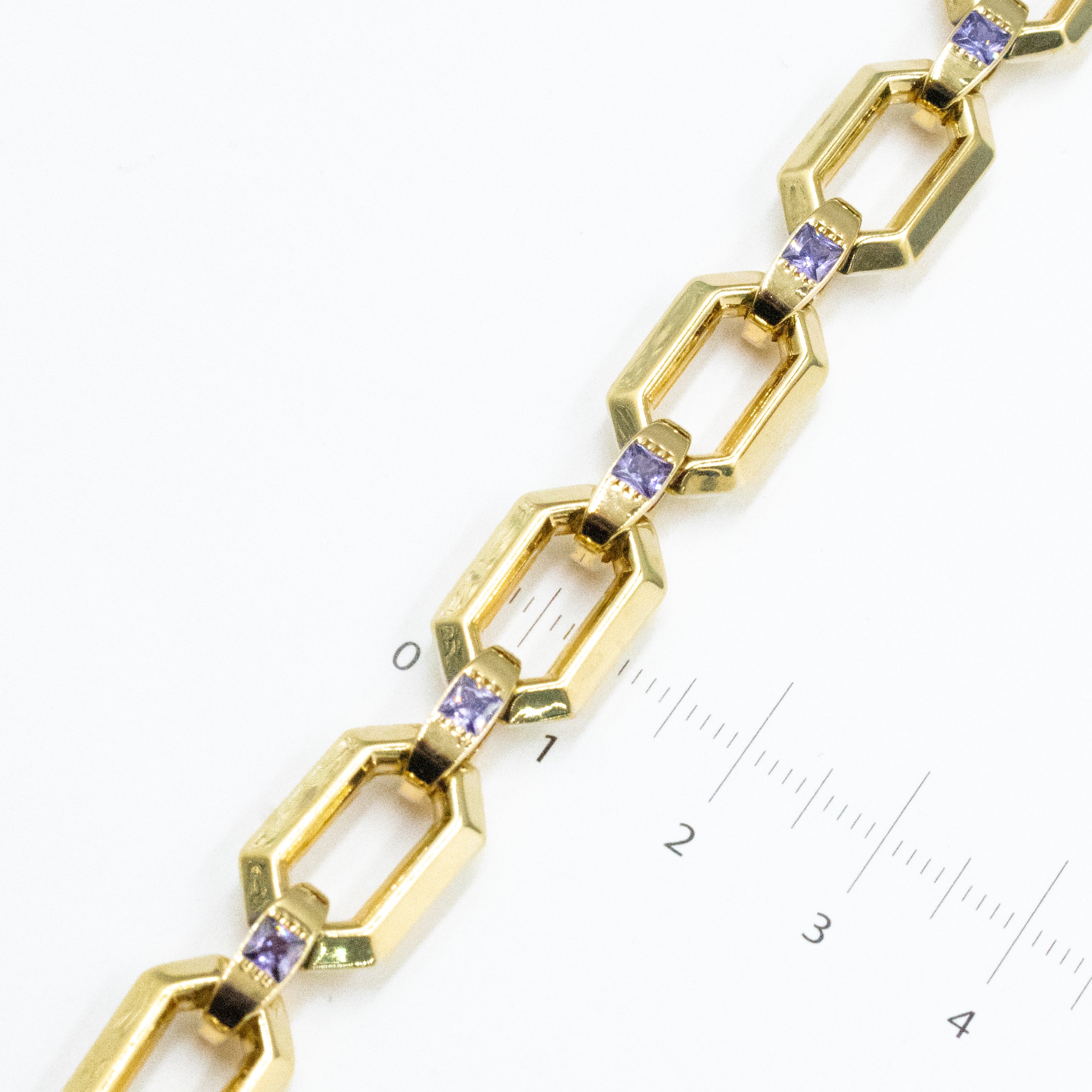 PULSERA CON PIEDRAS ZIRCONIAS MORADAS ORO 14K